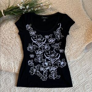 Whitehouse Blackmarket Black Top with White Floral Design on front